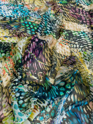Шифон принт калейдоскоп з міленьким різнокольоровим принтом в бірюзово-жовтій гамі