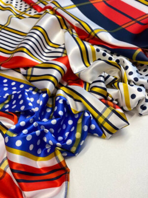 Шовкова тканина графічна абстракція зі смужками а горошками в синьо-червоно-чорній гамі