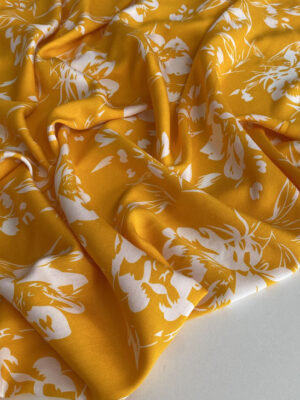 Штапель віскозний жовтий з рідкими білими квітами