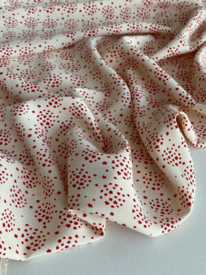 Суперсофт з з мілесенькими зірочками червоного кольору на молочному фоні