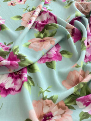 Віскозний льон пастельного відтінку світлий тіффані з крупними рожемими півоніями і зеленим листям