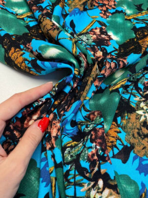 Віскозний льон яскравого бірюзового кольору з акбтракційним малюнком в коричнево-рижій гамці