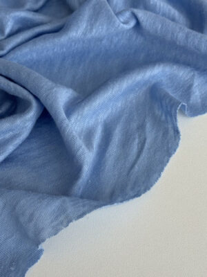 Льон трикотажний небесно-блакитного кольору напівпрозорий з рисочками