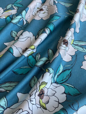 Полірований котон-сатин Італія бірюзового кольору з крупними білими квітами